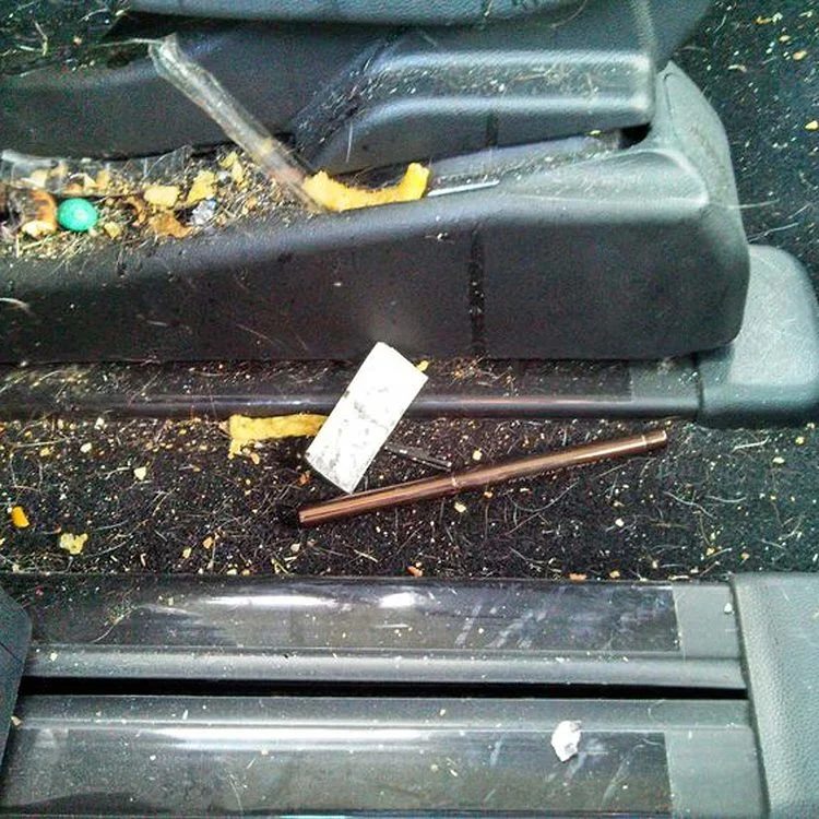 Console and door sill full of debris before interior detail